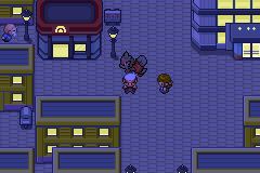 A Johto city at night under street lamps, with a Sneasel following the player