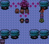 A dark forest clearing at night, a tall purple tree in the middle and two people standing under it