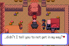 A villain team leader blocking the path in a red-roofed town