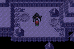 A dark purple cave room with a large shadowy figure standing in the middle