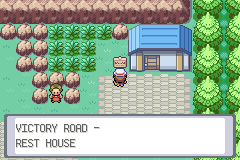 The player outside a small blue-roofed building, captioned Victory Road - Rest House