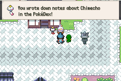 A snowy village street, with a message that notes about Chimecho have gone into the Pokédex