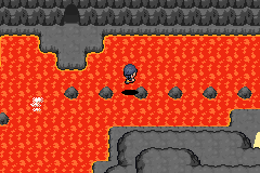 The player crossing a cavern floor of glowing lava on stepping stones, grey rock walls all around