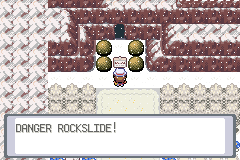 The player facing falling boulders in a rocky area, with the warning DANGER ROCKSLIDE!