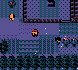 Rain falling as the player walks down a street between houses at night
