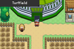 Turffield, with the player and a blonde trainer in front of the stadium's green domed entrance