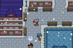 A snowy town with a purple-roofed hotel, market stalls and a pool in the corner