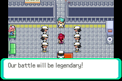 A grey-floored hall full of trainers in white, a blue-haired opponent in front of the player; the text box reads "Our battle will be legendary!"