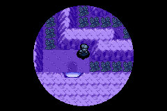 A dark purple cave lit only by a small circle of light around the player, the rest of the screen black