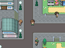 A town street at night beside a glass-fronted building, with NPCs standing near lampposts